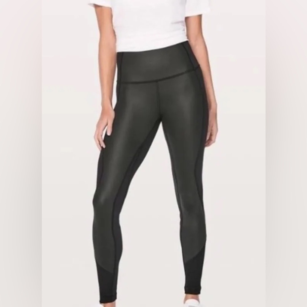 Lululemon black leggings with faux leather panel front. Size 4